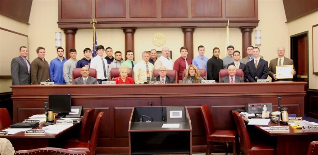 Coaches and players of the 2014 NJSIAA State Championship teams are recognized at the Monmouth County Board of Chosen Freeholders meeting on Feb. 26, 2015 in Freehold, NJ.